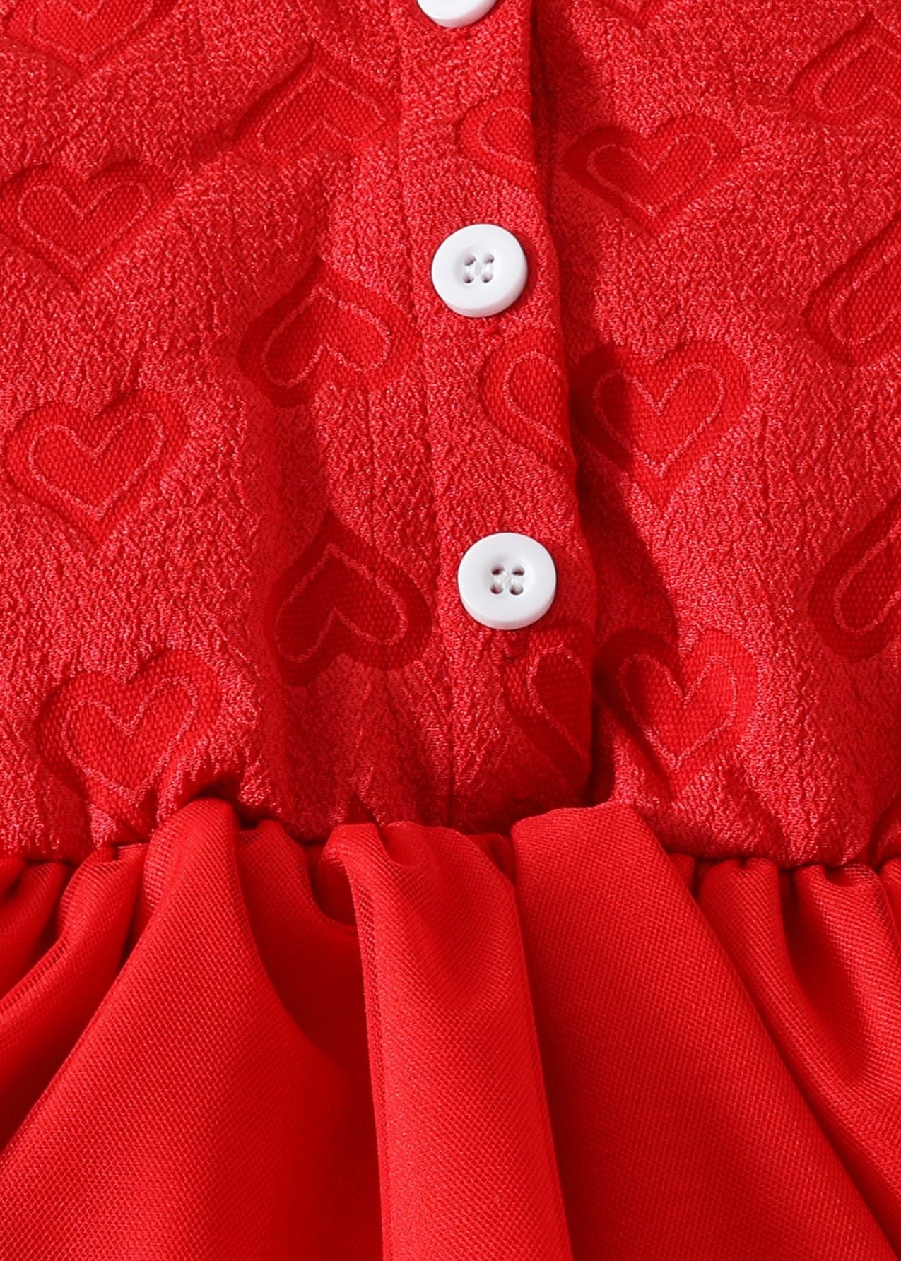 Red dress with heart patterns and white buttons
